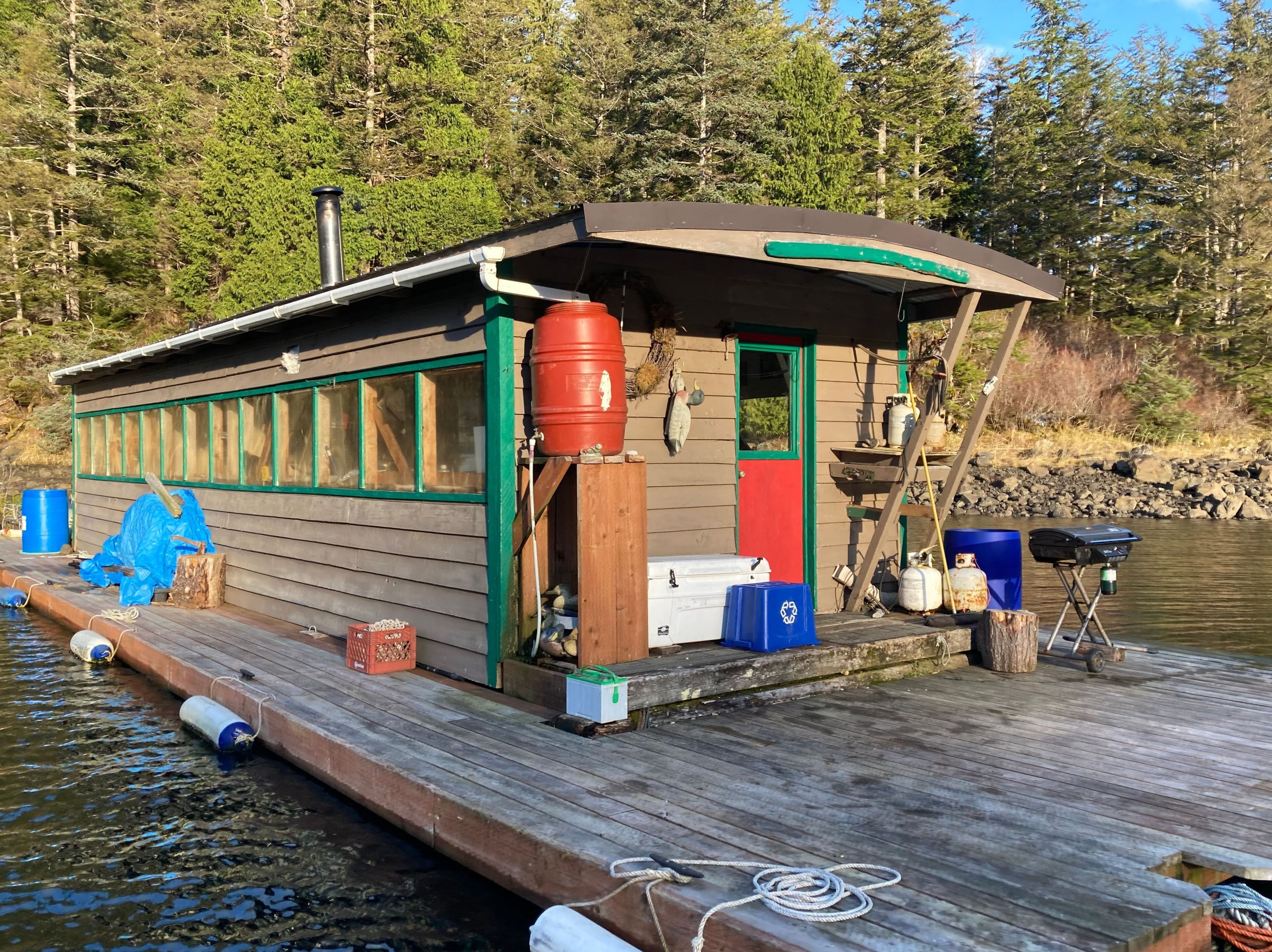 The Caboose floating cabin in a quiet bay