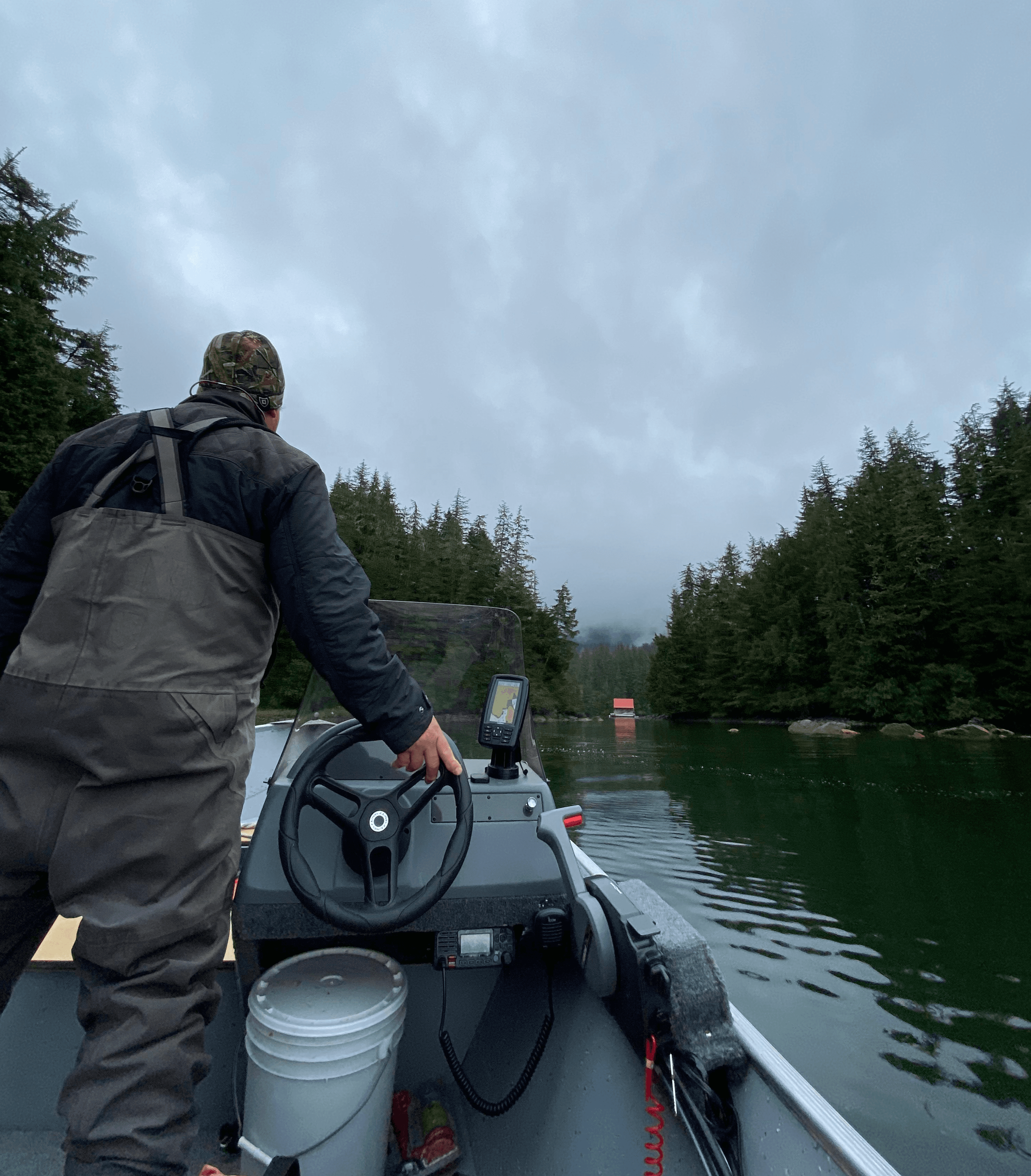 Captain Jim Phillips in Camp Coogan bay on his skiff.