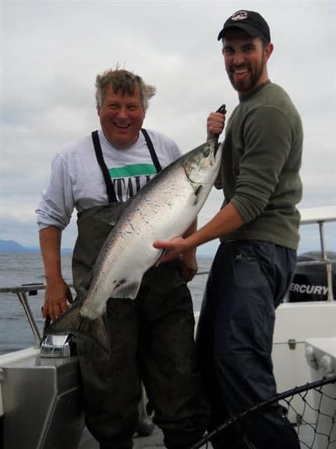 Captain Jim Phillips with client and king salmon